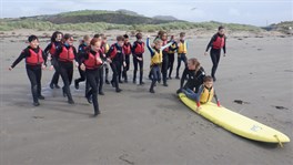 Learning to surf at Black Rock Sands in North Wales